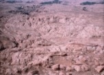This is the rugged sandstone terrain that caused the mission scouts to doubt the feasibility of making a wagon road. The Colorado River gorge/Hole-in-the-Rock is visible at the top of the image. The lower half of the image is the area of the Chute. Lamont Crabtree Photo